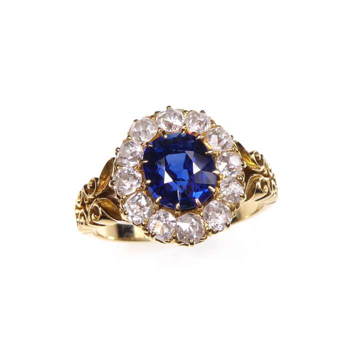 Sapphire and diamond cluster ring, central cushion cut sapphire